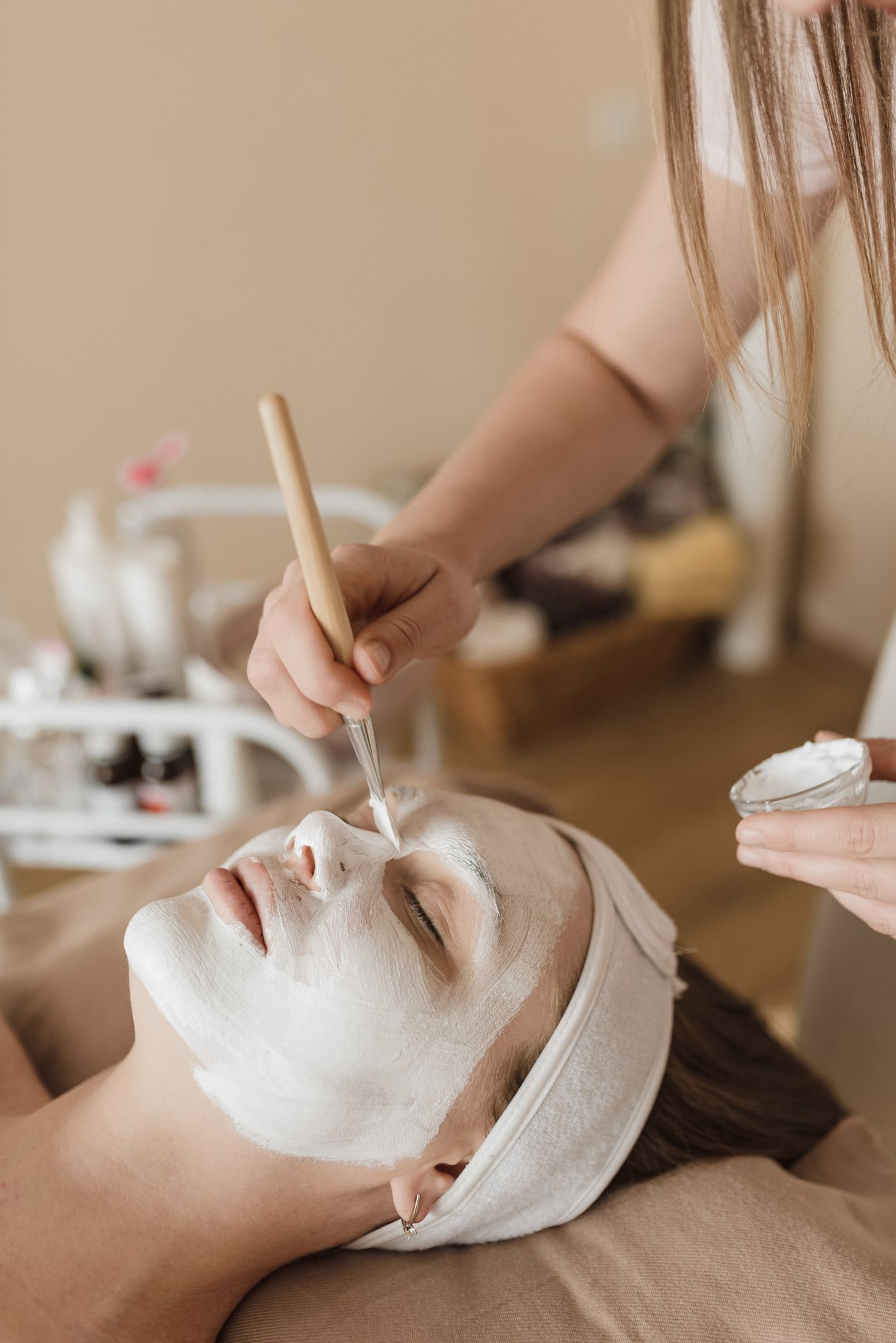 A client receiving a relaxing facial treatment